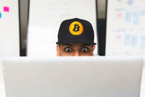 shocked bitcoin investor on laptop - Image of Cryptocurrency Investing, "Boomers investing in crypto